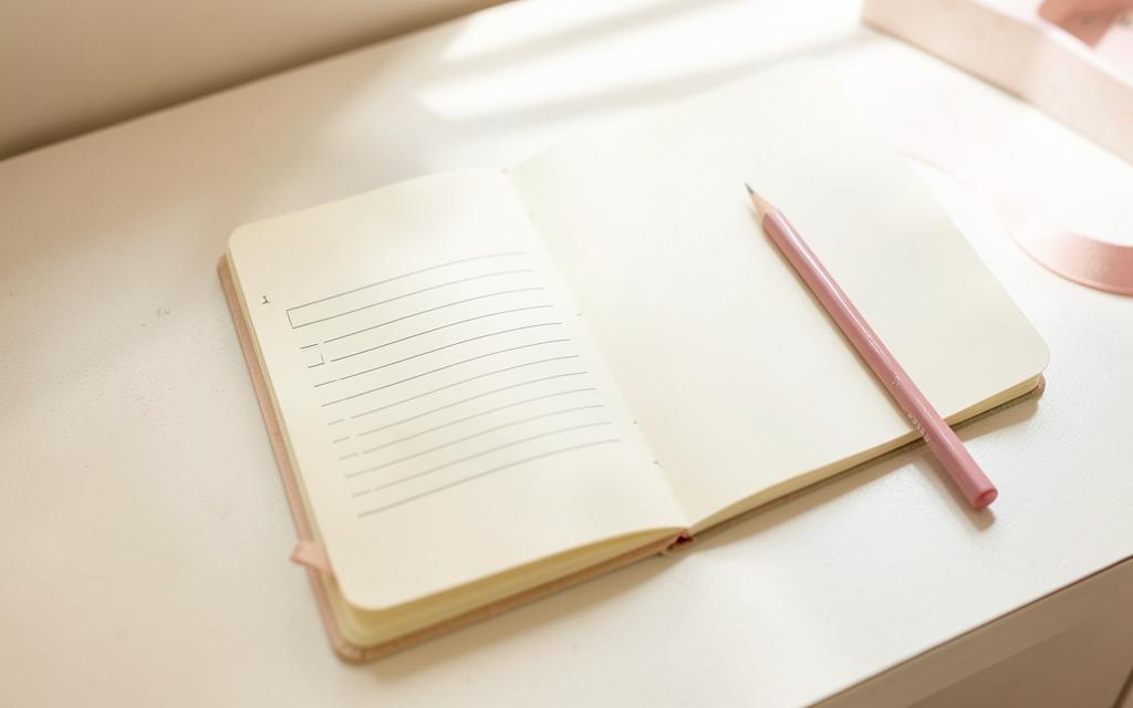 An open notebook and pencil ready for planning